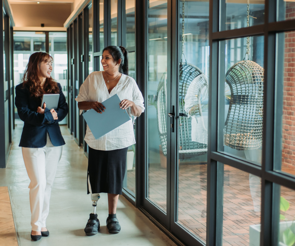 women talking in hallway