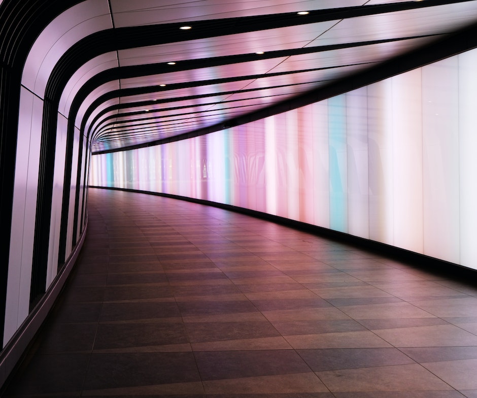 colorful lights inside a curved tunnel