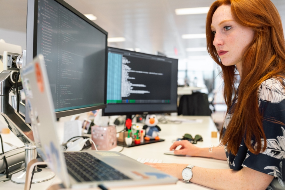 Woman working at computer desk