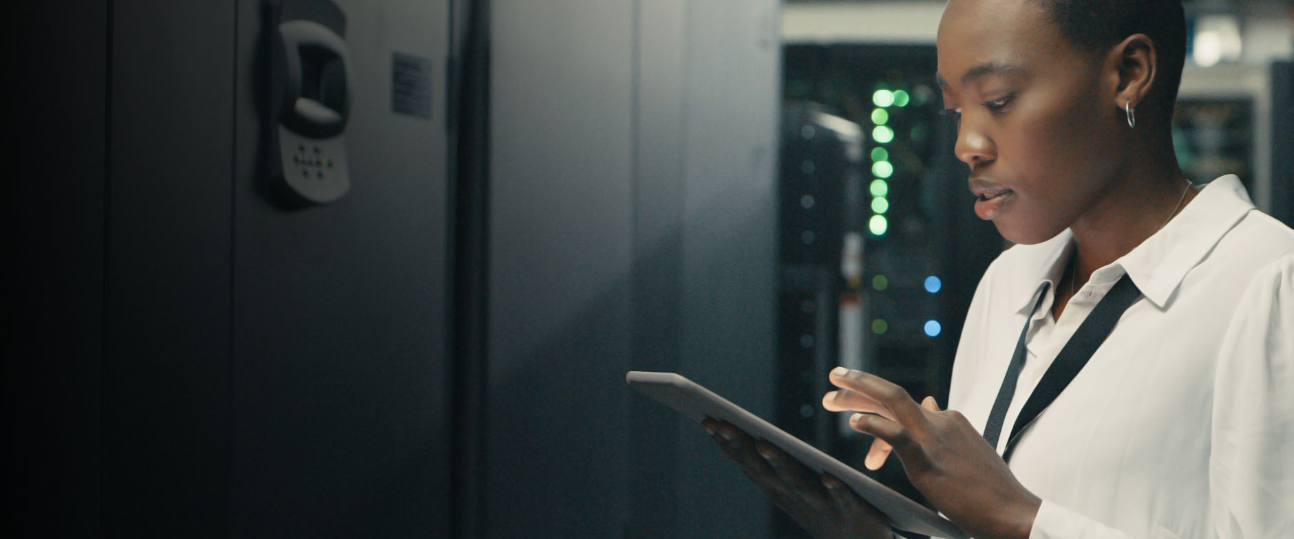 person looking at tablet in storage room