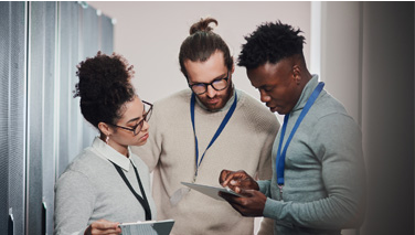 Three professionals collaborating