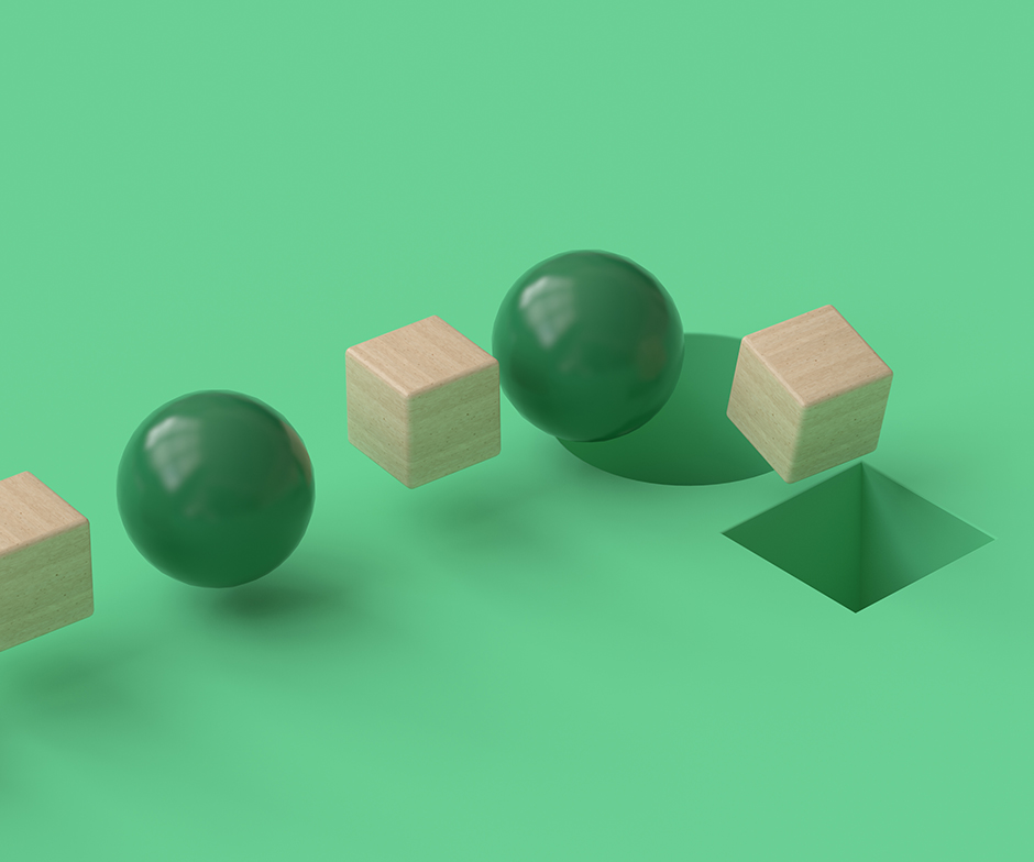 woode cubes and green spheres going down holes